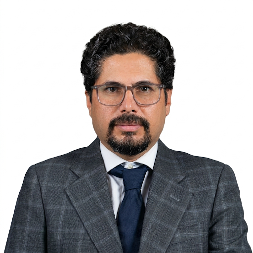 Professional headshot portrait in a corporate setting.