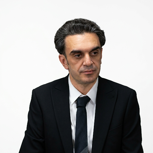 Professional headshot portrait in a corporate setting.